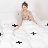 Therapiedekens beddengoedset met zwarte kruisen